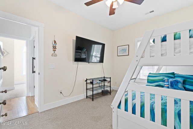 bedroom featuring wood-type flooring and ceiling fan