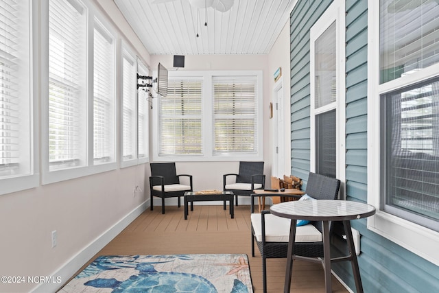 sunroom featuring plenty of natural light and ceiling fan