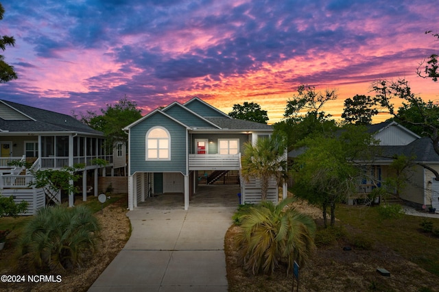 coastal inspired home featuring a carport