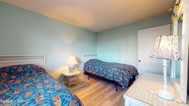 bedroom with light wood-type flooring