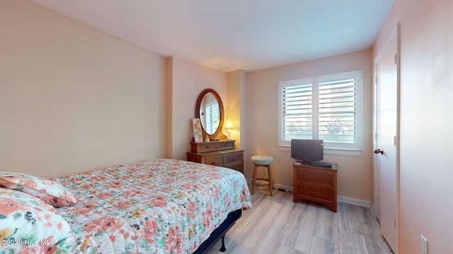 bedroom with light wood-type flooring