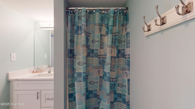 bathroom with vanity and curtained shower