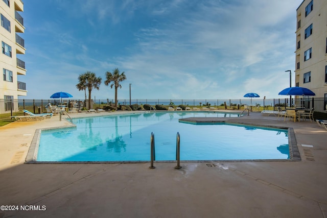 view of pool featuring a patio