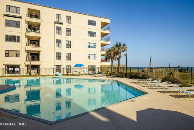 view of swimming pool with a patio area