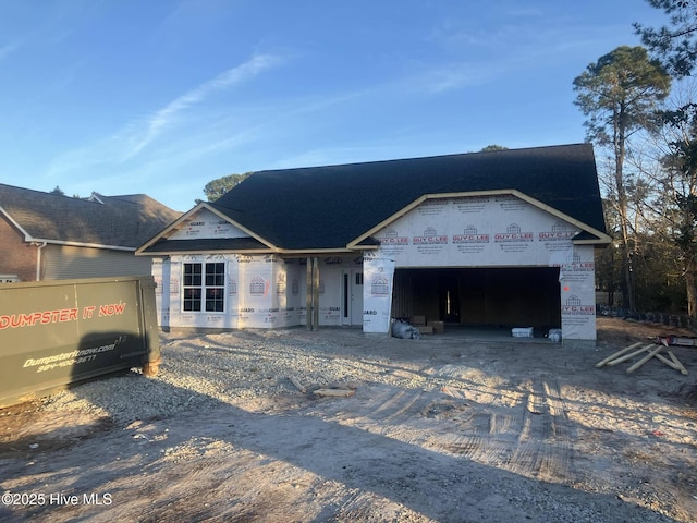 unfinished property with a garage