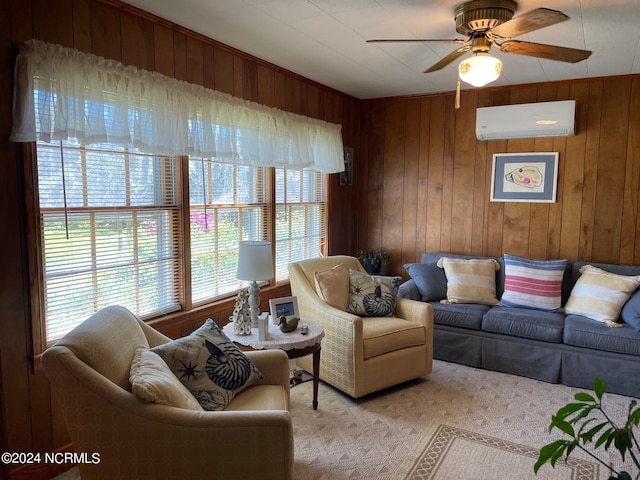 living room with ceiling fan, wooden walls, and a wall mounted air conditioner