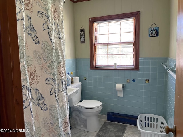 bathroom with tile floors, tile walls, and toilet