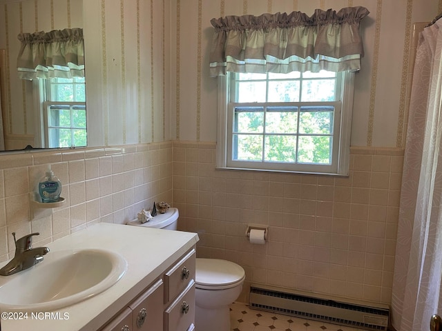 bathroom featuring a baseboard radiator, tile floors, tile walls, oversized vanity, and tasteful backsplash