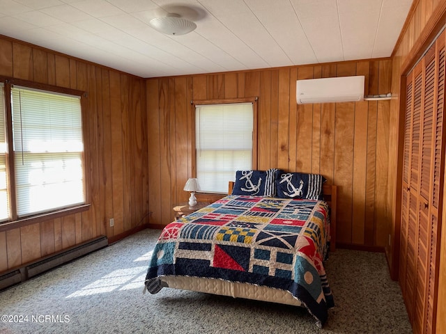 bedroom featuring a closet, carpet, a wall mounted air conditioner, wood walls, and baseboard heating