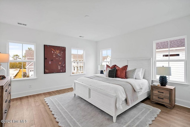 1134 Trisail Ter, Wilmington, NC 28412 - bedroom with light wood-type flooring and baseboards