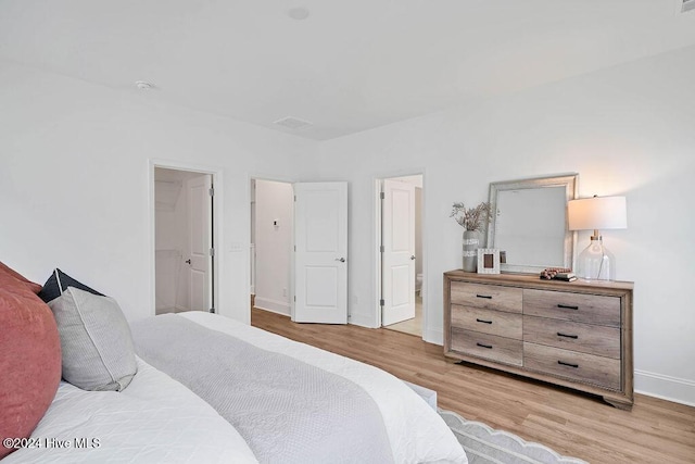 1134 Trisail Ter, Wilmington, NC 28412 - bedroom featuring light wood-style flooring and baseboards