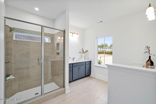 1134 Trisail Ter, Wilmington, NC 28412 - full bathroom with a shower stall, tile patterned floors, vanity, and baseboards