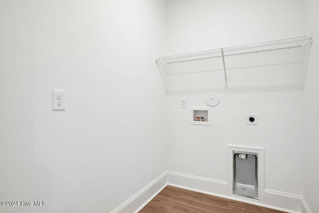 1134 Trisail Ter, Wilmington, NC 28412 - laundry room featuring hookup for an electric dryer, washer hookup, baseboards, dark wood-style flooring, and gas dryer hookup