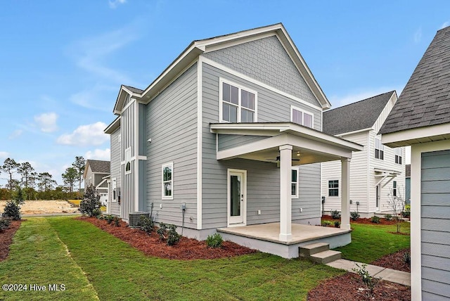 1134 Trisail Ter, Wilmington, NC 28412 - rear view of house with ceiling fan, a lawn, central air condition unit, and a patio area
