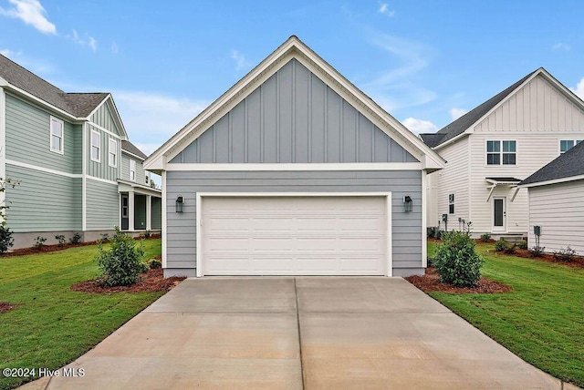 1134 Trisail Ter, Wilmington, NC 28412 - craftsman house featuring board and batten siding, concrete driveway, a front yard, and an attached garage