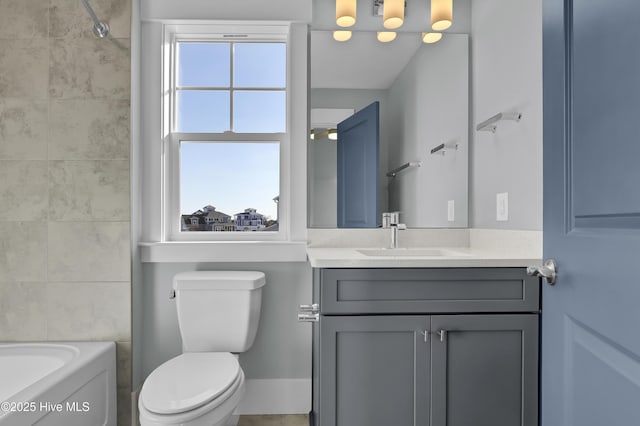 full bathroom featuring vanity, tiled shower / bath combo, plenty of natural light, and toilet