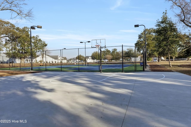 view of basketball court featuring tennis court