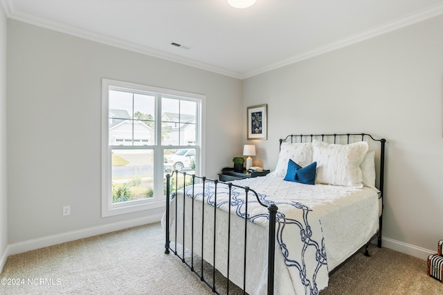 carpeted bedroom with crown molding