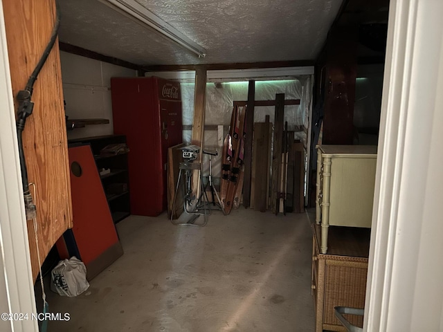 basement featuring a textured ceiling