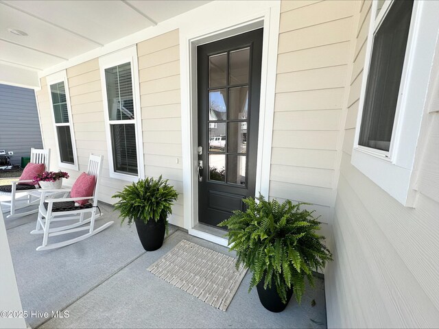 view of front facade with a porch, a garage, and a front yard