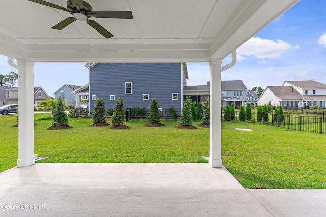 view of patio with a residential view, ceiling fan, and fence