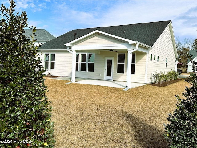 back of property featuring a shingled roof, a patio area, and ceiling fan