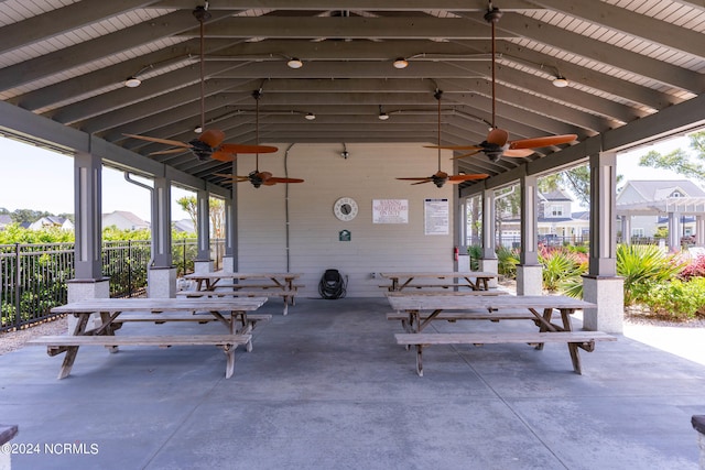 view of patio featuring outdoor dining space and fence