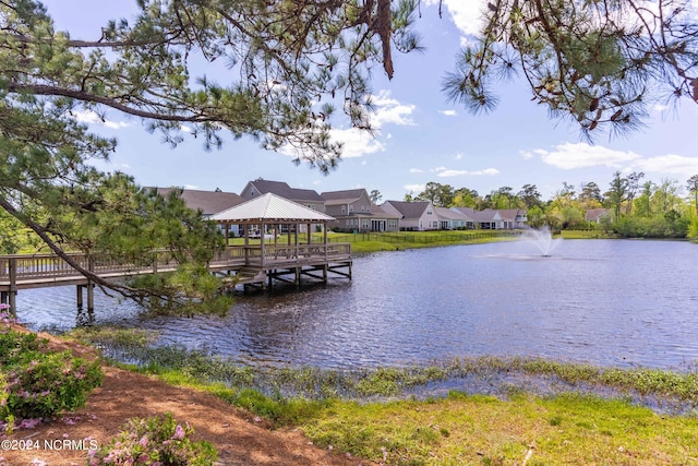 dock area with a gazebo and a water view