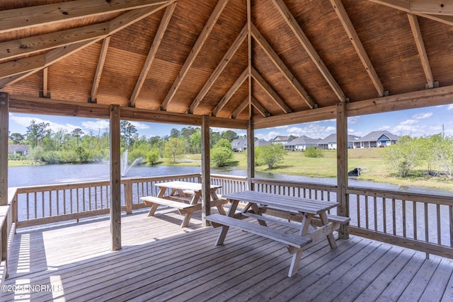 dock area featuring a deck with water view