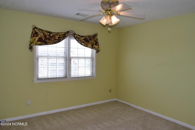 unfurnished room featuring carpet flooring and ceiling fan