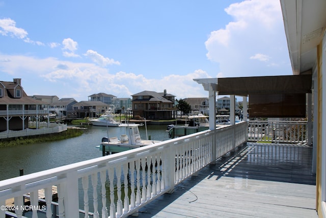 exterior space featuring a boat dock and a water view