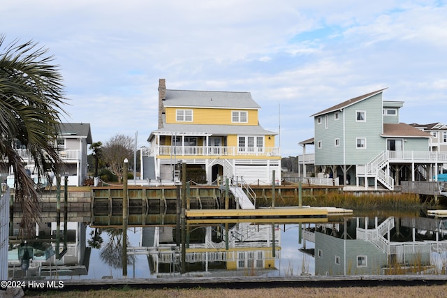 rear view of property featuring a water view