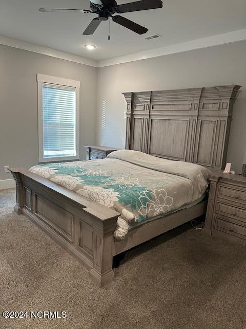 carpeted bedroom featuring ceiling fan