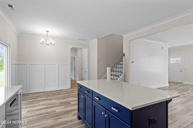 kitchen with blue cabinets, light hardwood / wood-style flooring, a notable chandelier, a kitchen island, and hanging light fixtures