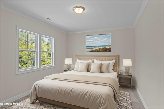 bedroom featuring carpet floors and crown molding