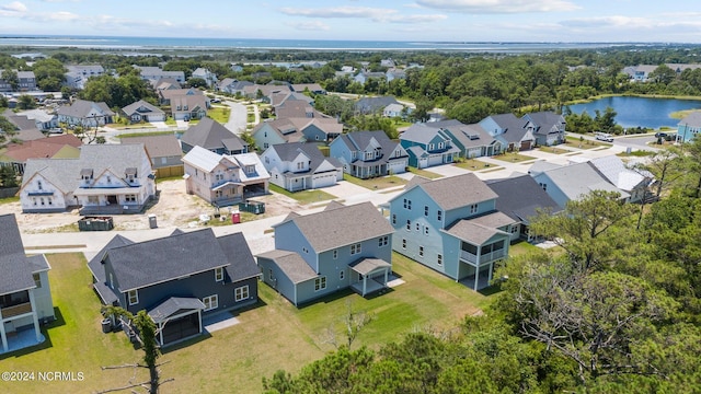 drone / aerial view with a water view