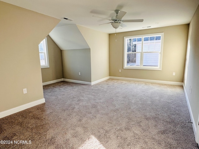 additional living space featuring vaulted ceiling, ceiling fan, and carpet floors