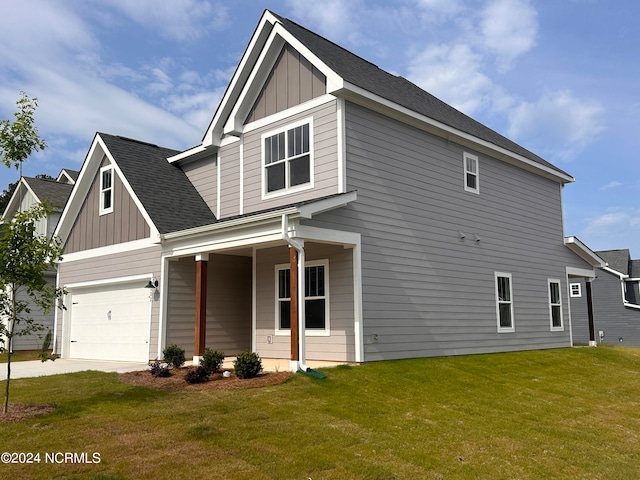 view of front facade with a front yard and a garage