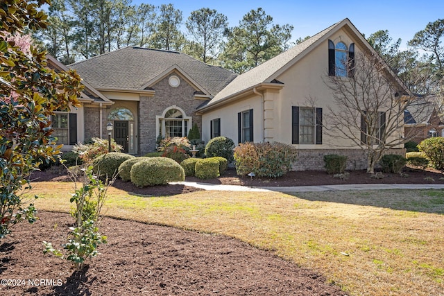 front of property featuring a front lawn