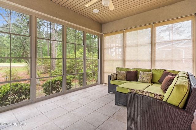 sunroom / solarium featuring wood ceiling and ceiling fan