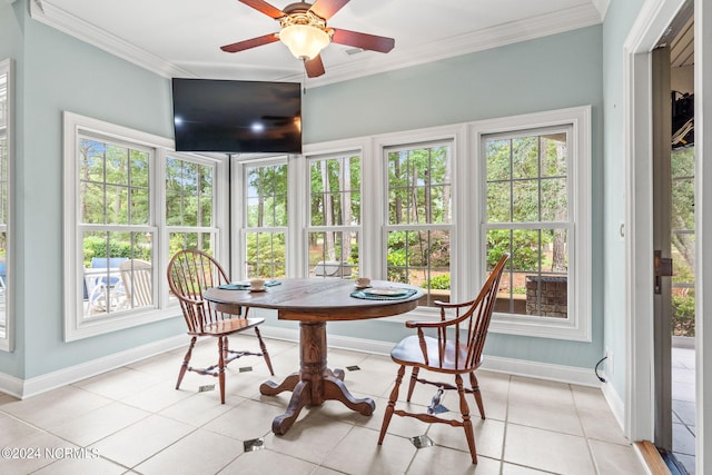 tiled dining area featuring ornamental molding, plenty of natural light, and ceiling fan