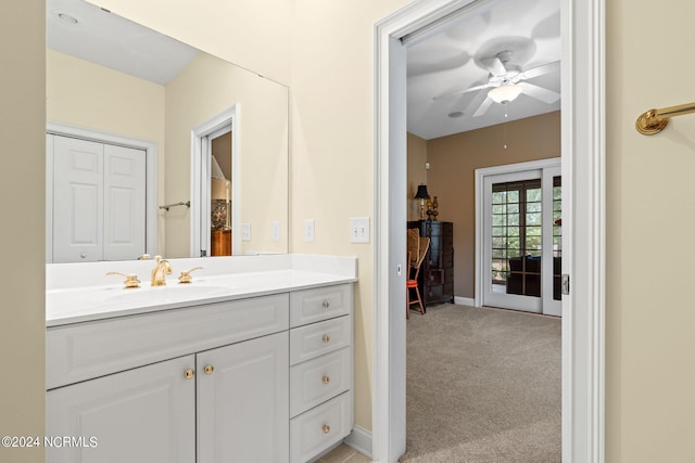 bathroom featuring ceiling fan and vanity