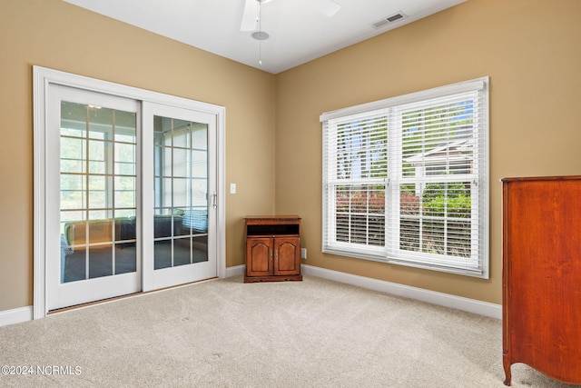 carpeted empty room with ceiling fan