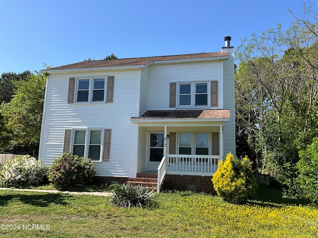 view of front of home with a front lawn and a porch