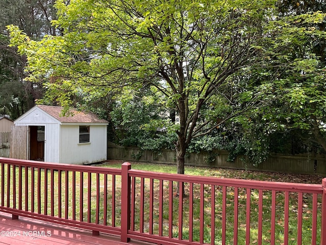 deck featuring a storage shed