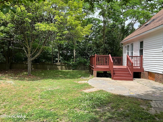 view of yard featuring a wooden deck