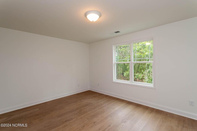 full bathroom with tile flooring, combined bath / shower with glass door, vanity, and toilet