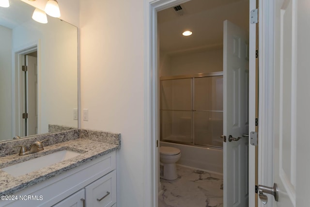 bathroom featuring toilet, recessed lighting, vanity, marble finish floor, and combined bath / shower with glass door