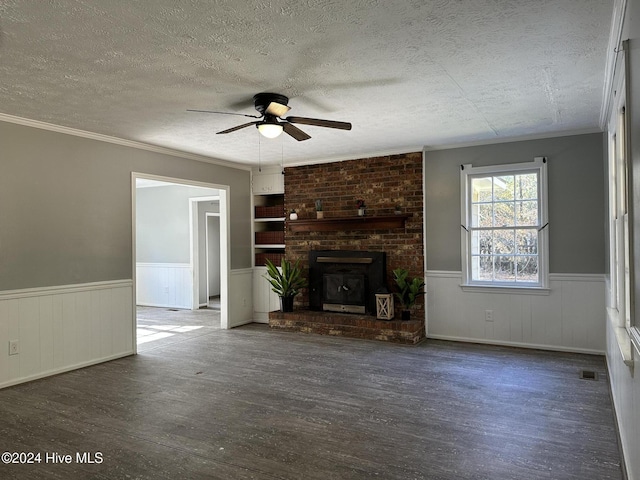 unfurnished living room featuring a fireplace, ceiling fan, dark hardwood / wood-style flooring, and a textured ceiling