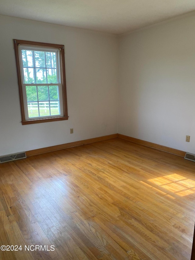 empty room with light wood-type flooring